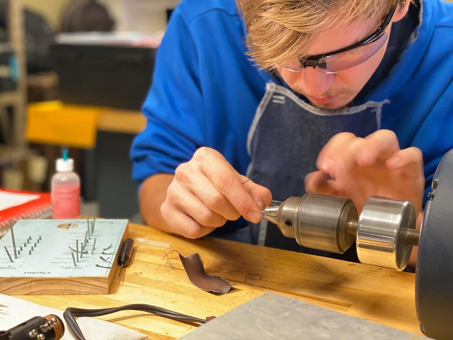 Harrison working with a bench motor.